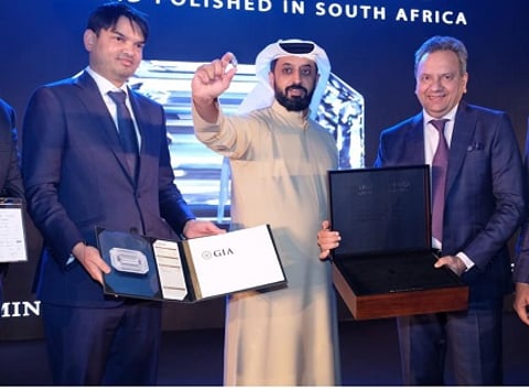 Ahmed Bin Sulayem, Executive Chairman, and CEO, DMCC holds The Light of Africa a 103.49-carat polished diamond 